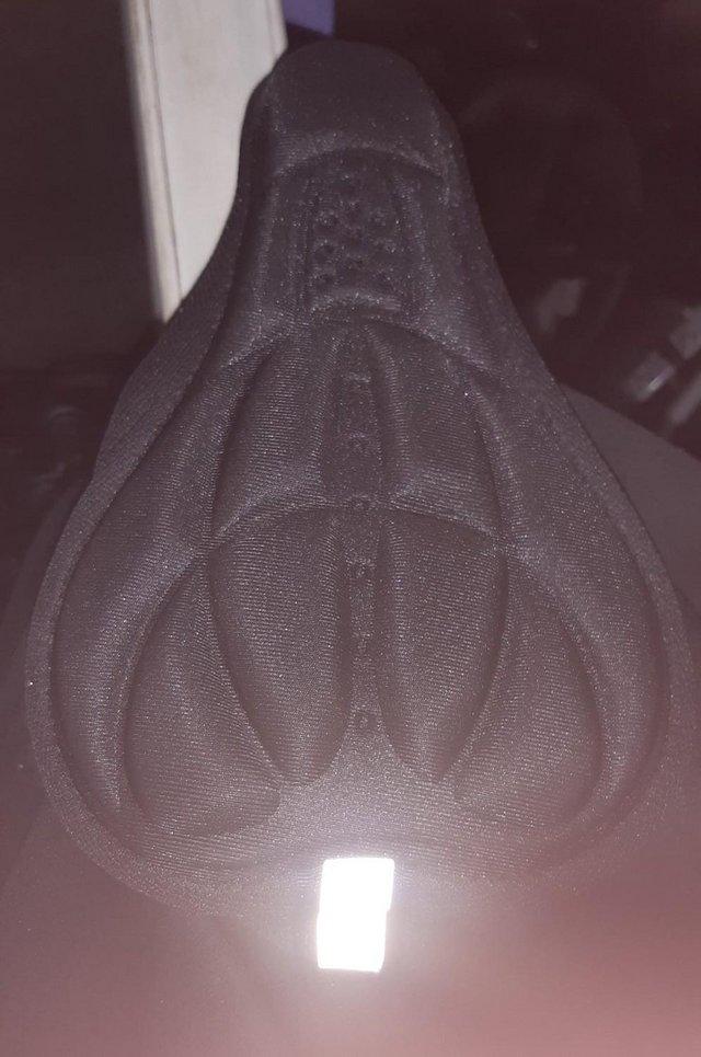 Preview of the first image of New Padded, slip-on bike seat cover.