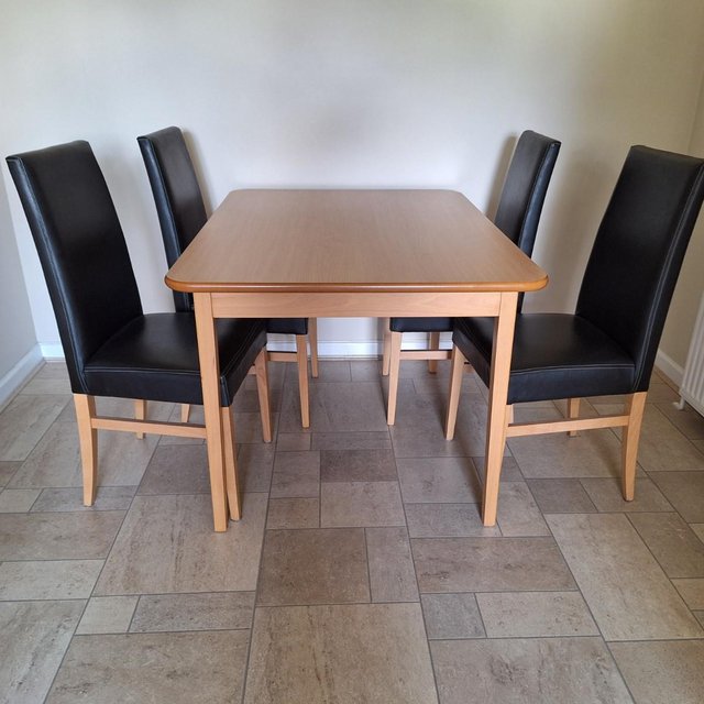 Preview of the first image of Beech table and 4 John Lewis chairs.