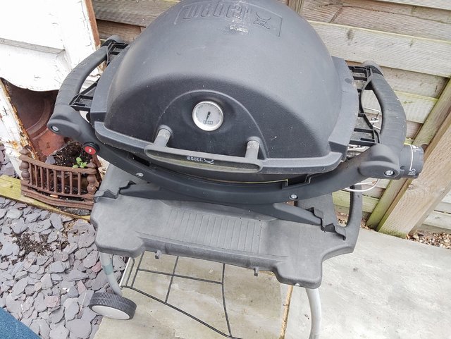 Preview of the first image of Weber Q100 BBQ and stand.
