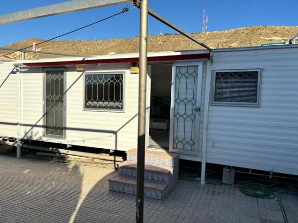 Image 8 of RS 1736 mobile home with communal pool and bar on site
