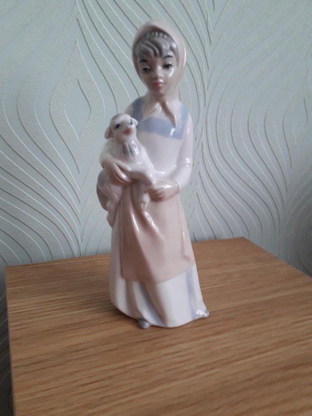 Preview of the first image of Vintage Sango porcelain figurine Girl with lamb..