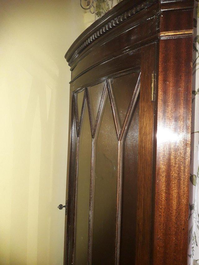 Preview of the first image of Corner cabinet with key solid wood vgc.