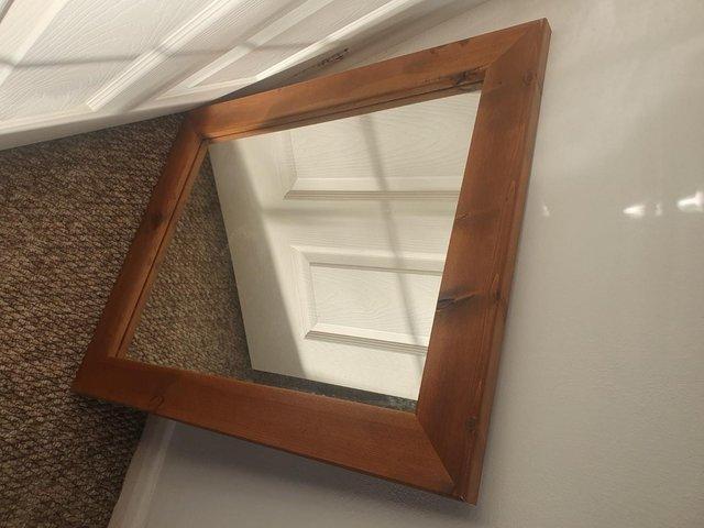 Preview of the first image of Large Beautiful Rectangular Mirror with a Nice Wooden Surrou.