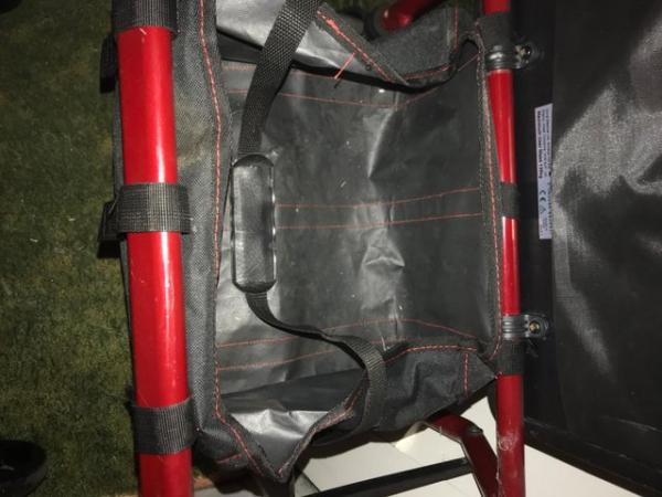 Image 2 of Rollator/walker. With seat by Drive colour red