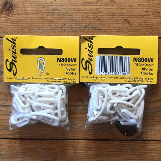 Preview of the first image of Unused 2 packs each 25 Swish white nylon curtain hooks..