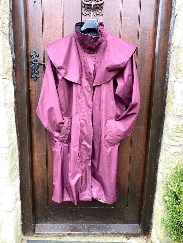 Preview of the first image of Donegal Ladies Waterproof Coat -Blackberry (size 16).