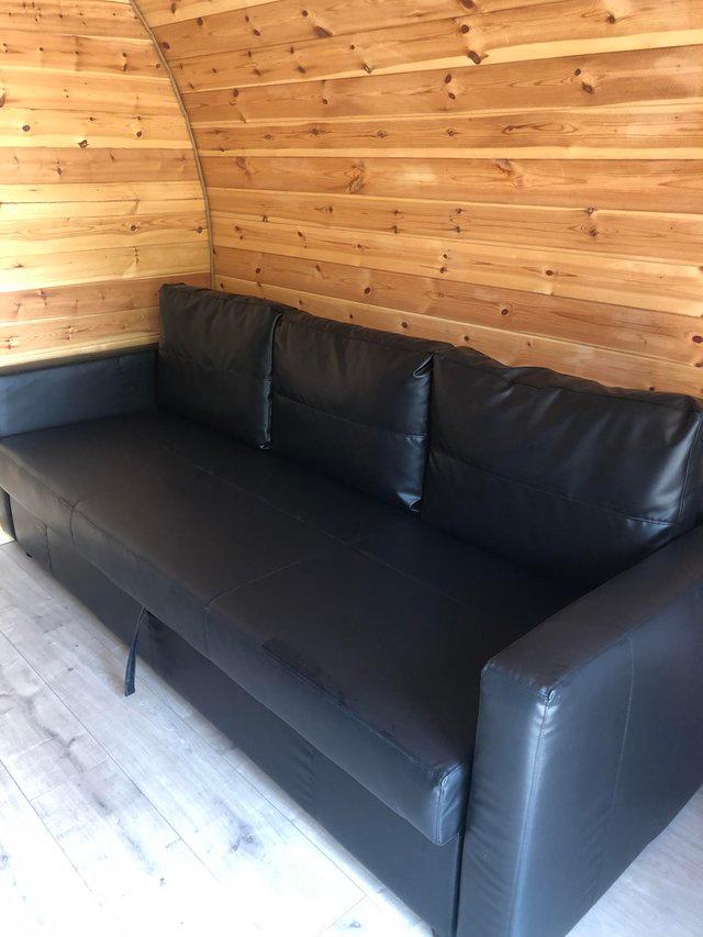 Preview of the first image of Bargain IKEA double sofa bed black. 2 months old..