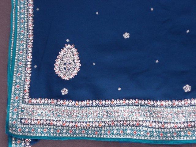 Preview of the first image of Indian navy blue and green saree.