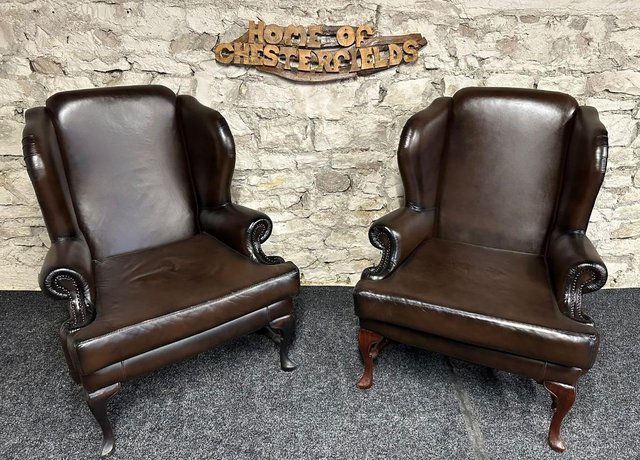 Preview of the first image of Queen Anne Wingbacked Armchair x2 Brown Leather & footstool.