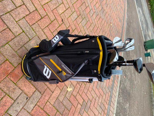 Preview of the first image of Brand new golf bag and used clubs.