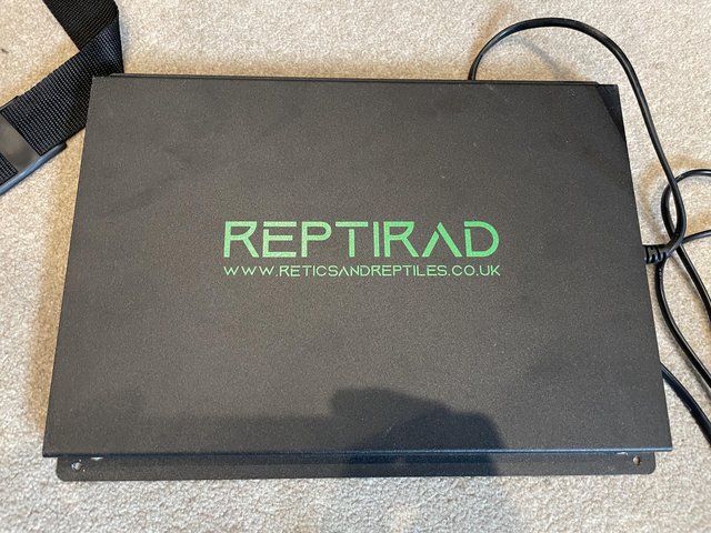 Preview of the first image of Reptirad 80 watt heater and heat guard.