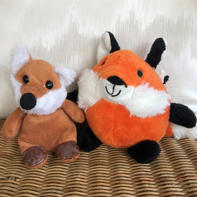 Preview of the first image of 2 fox soft toys. Damage to one ear. £2 both. Can post..