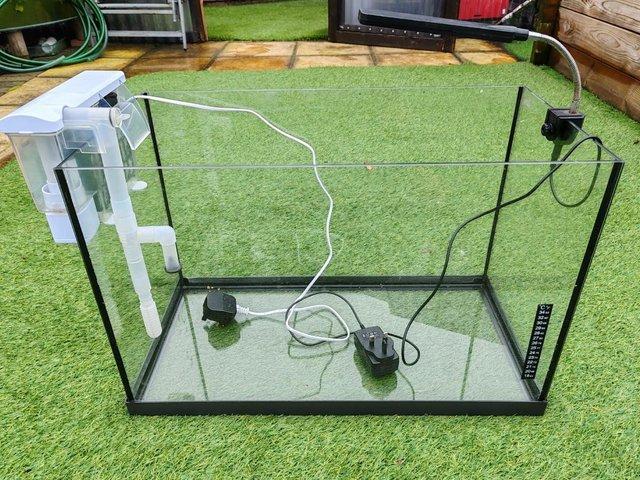 Preview of the first image of BIG FISH TANK WITH FILTER AND LIGHT 70 LITRES 24 X 12 X 15H.