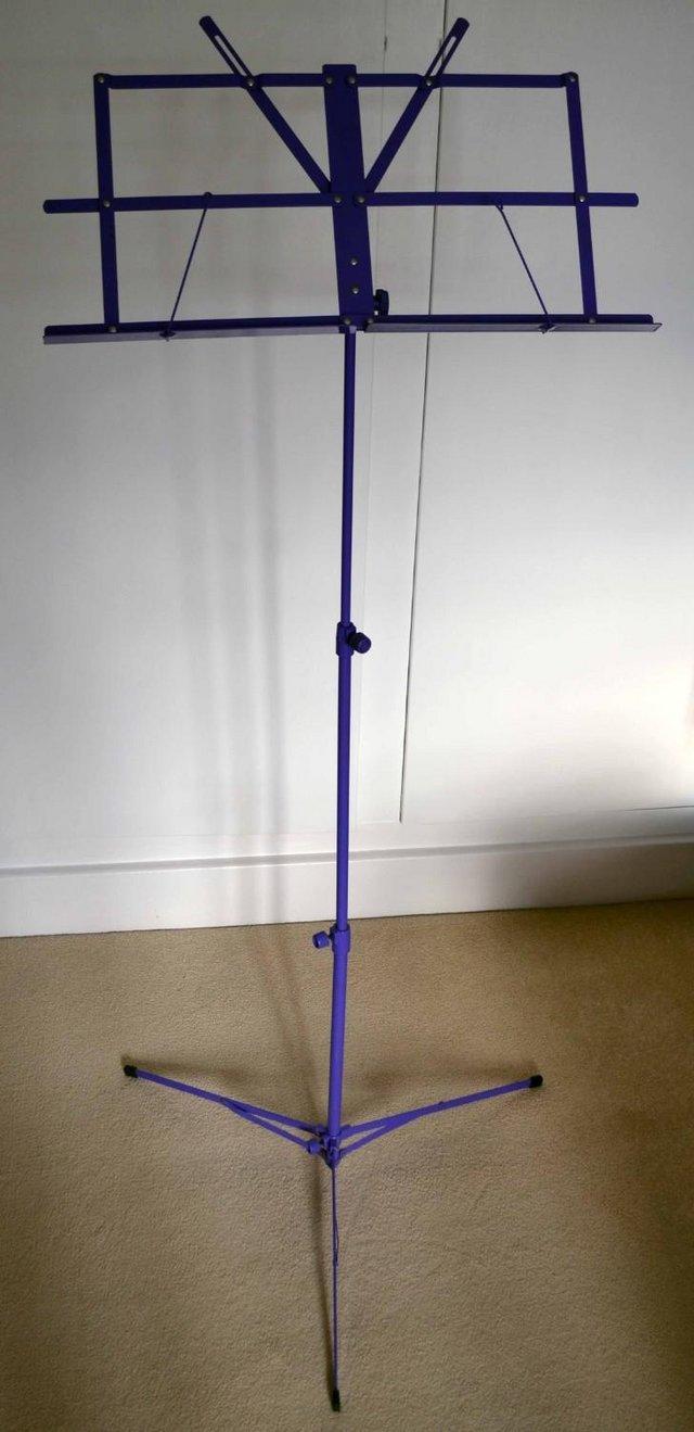 Preview of the first image of Purple adjustable child's folding sheet music stand.