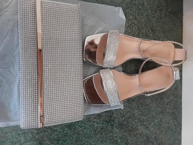 Preview of the first image of Sparkly silver sandals and cluch bag..