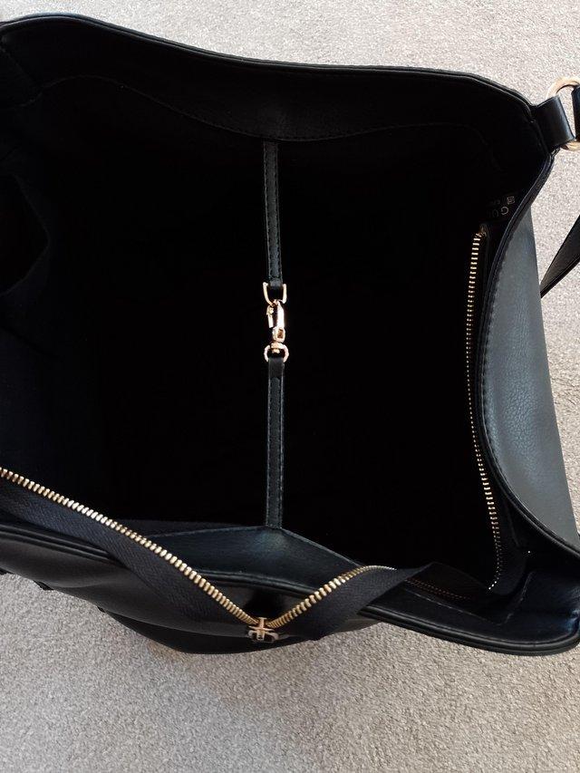 Preview of the first image of Handbag black large handles leather.