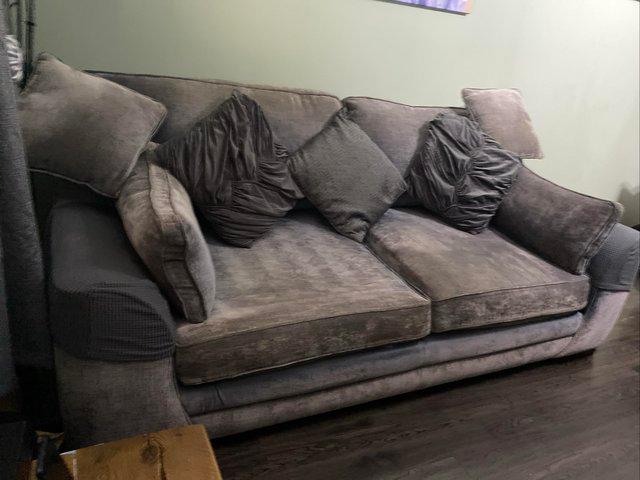 Preview of the first image of 3 seater sofa with a PS3 for sale.