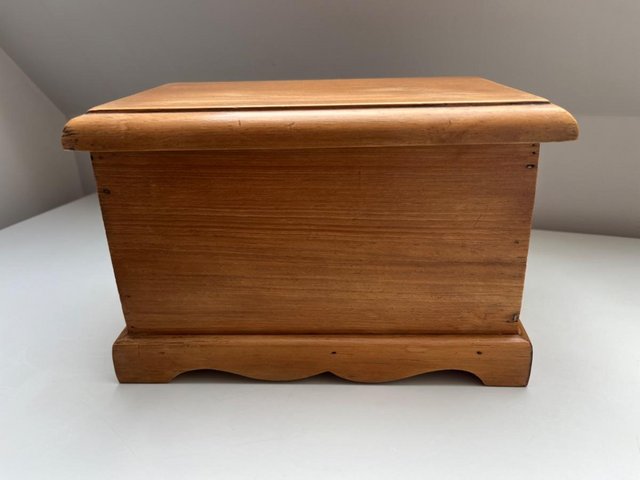 Preview of the first image of Antique pine waxed small wooden chest with hinged lid.