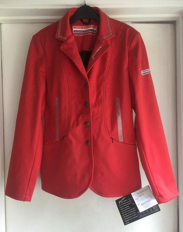 Preview of the first image of John Whitaker Ladies Jump Jacket Red BNWT.