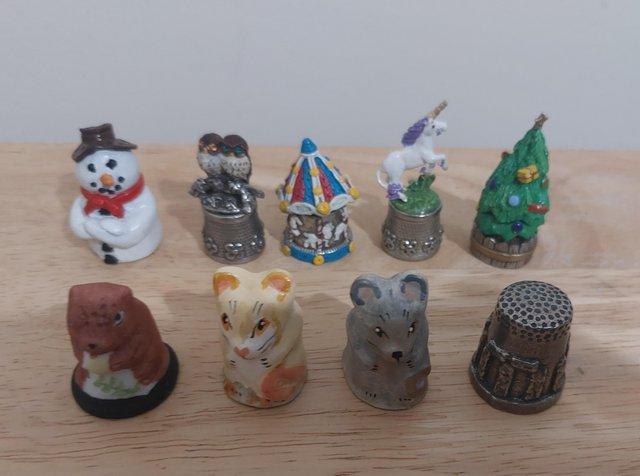 Preview of the first image of Collector thimbles- 3 x pottery 6 x pewter.