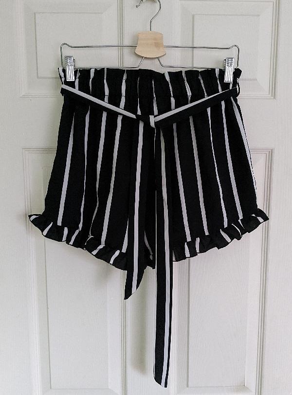 Preview of the first image of Lovely Ladies Black & White Striped Shorts By Shein - Size L.