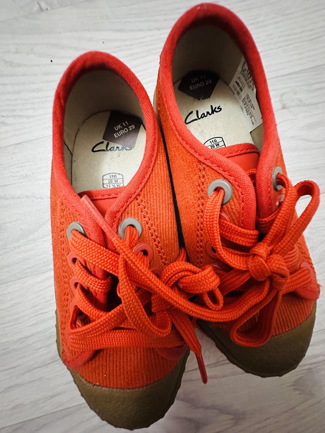 Preview of the first image of Boys Clarks orange shoes.