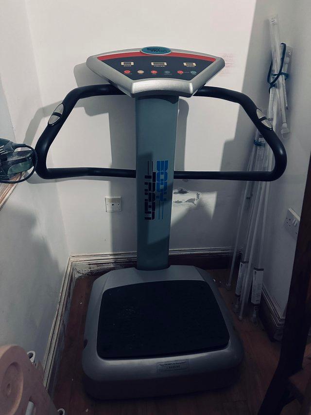 Preview of the first image of Body Train vibration stand on machine with arms.