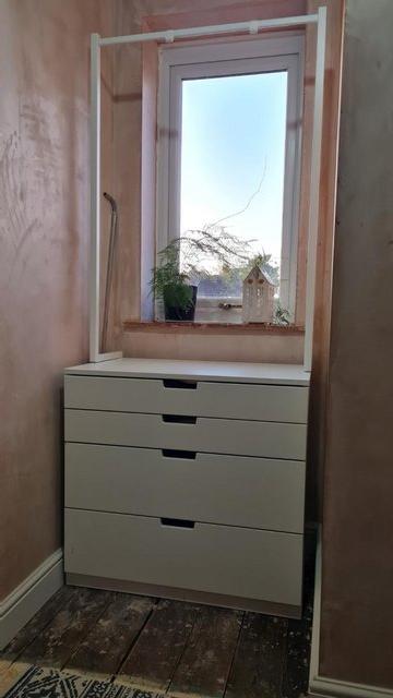Preview of the first image of Set of white drawers with clothes rail..