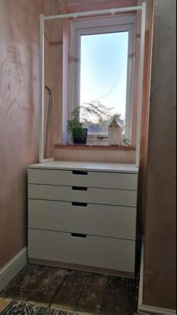 Image 1 of Set of white drawers with clothes rail.