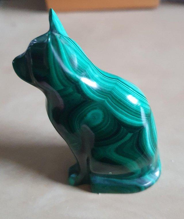 Preview of the first image of Malachite cat, in sitting position.