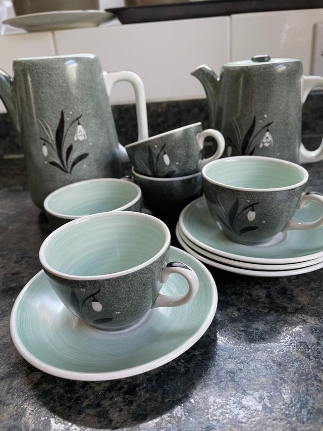 Preview of the first image of Four cups and saucer tea set with milk jug.