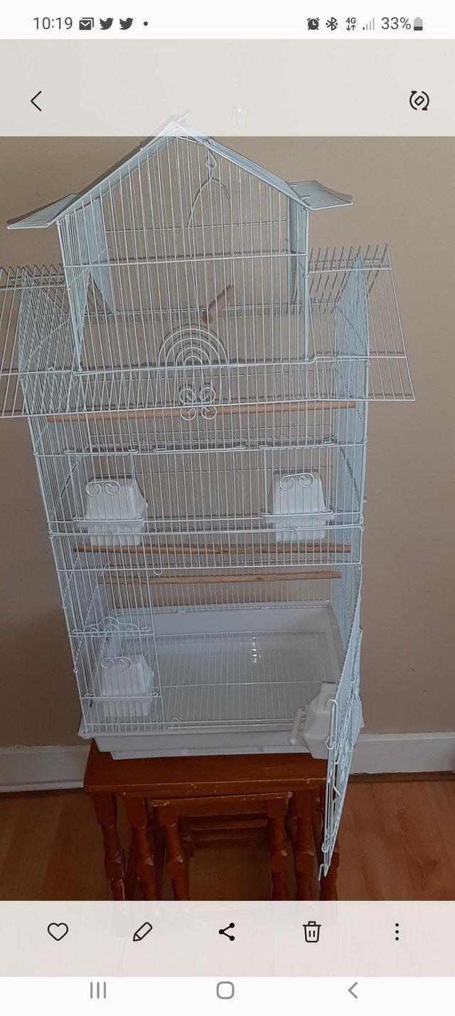 Preview of the first image of New Pagoda  style  cage with feeders and perches.