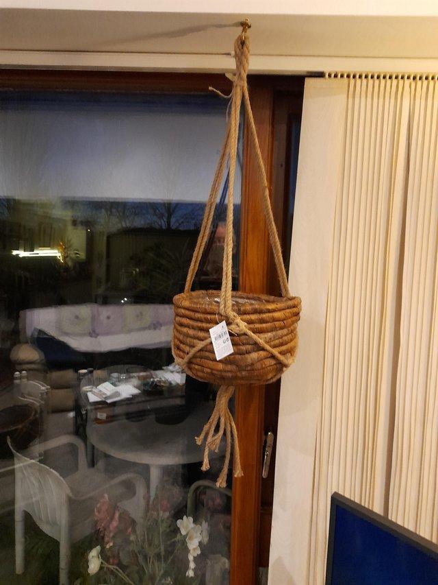 Preview of the first image of Woven hanging baskets with rope hanger..