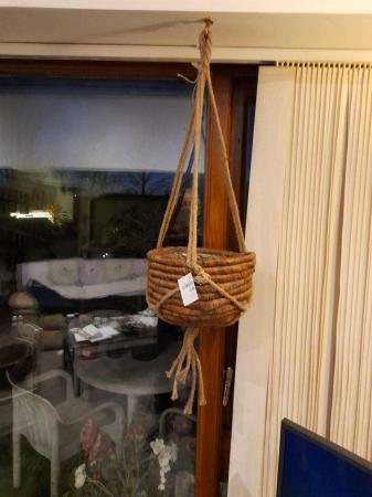 Image 1 of Woven hanging baskets with rope hanger.
