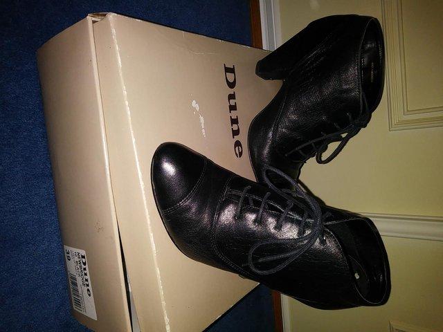 Preview of the first image of LADIES DUNE BLACK LEATHER BOOTS.