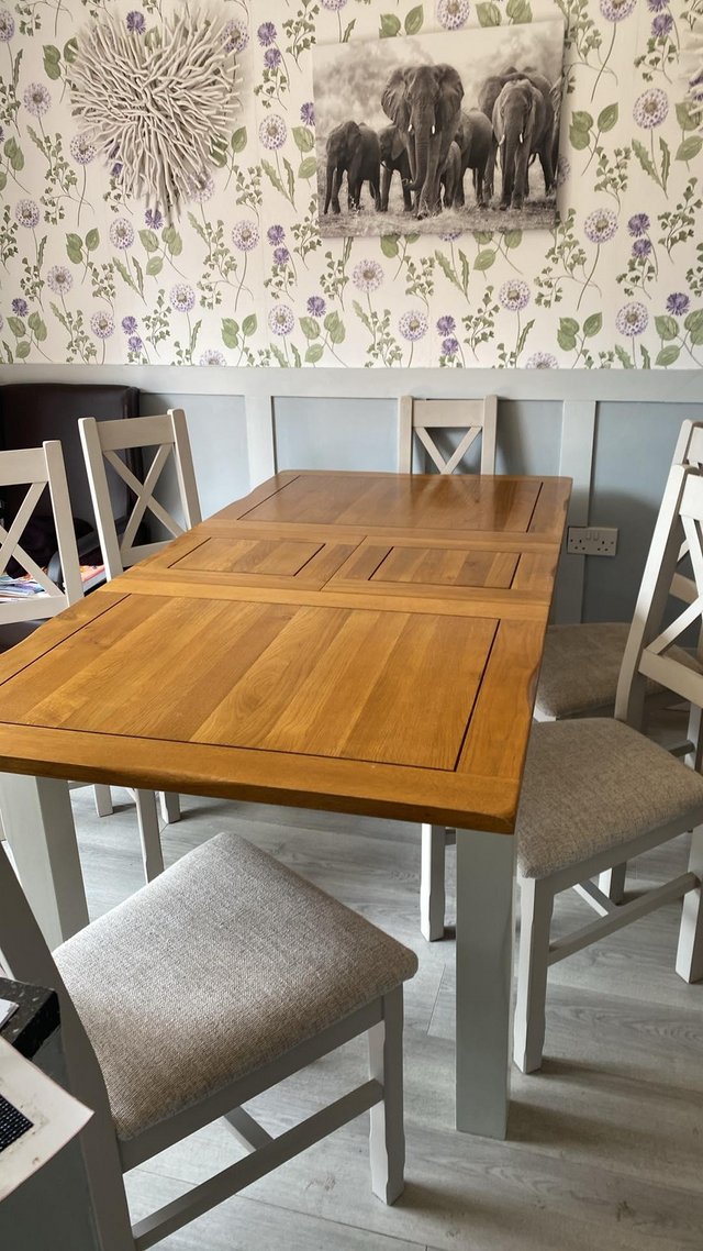 Preview of the first image of Solid oak extendable dining table and 6 chairs.