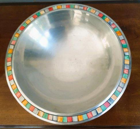 Image 1 of A large metal bowl with a pretty edging