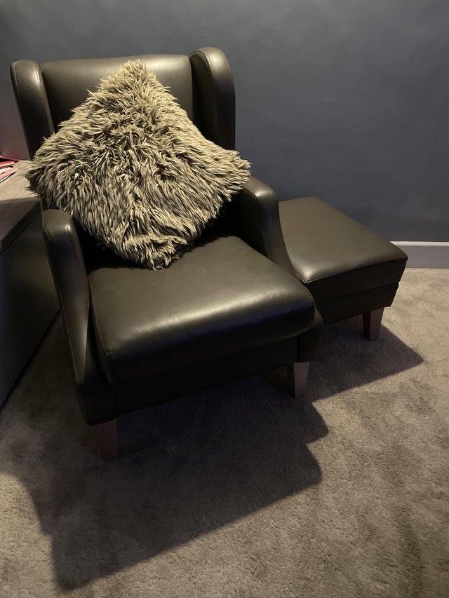 Preview of the first image of Faux leather lounge chair & footstool.