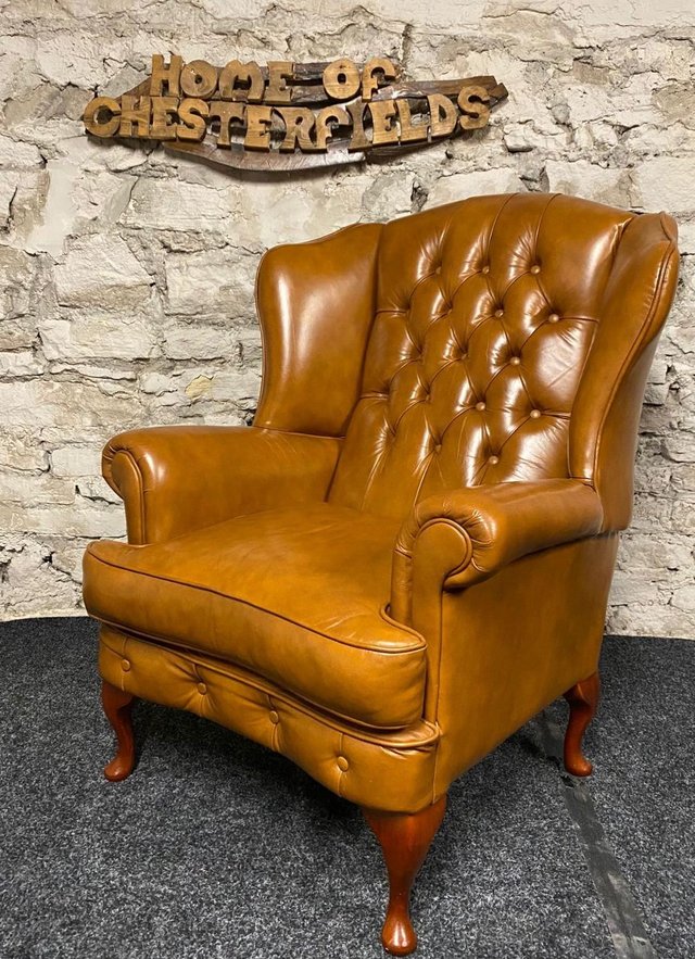 Preview of the first image of Queen Anne Wingbacked Armchair Tan Leather.