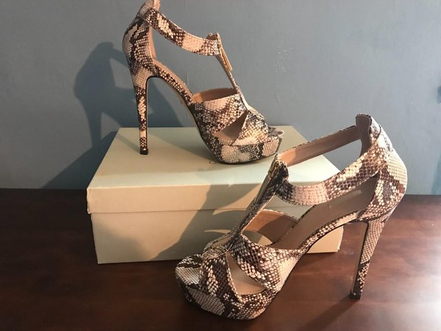 Preview of the first image of Jessica Simpson Snakeskin High Heels - size 5.