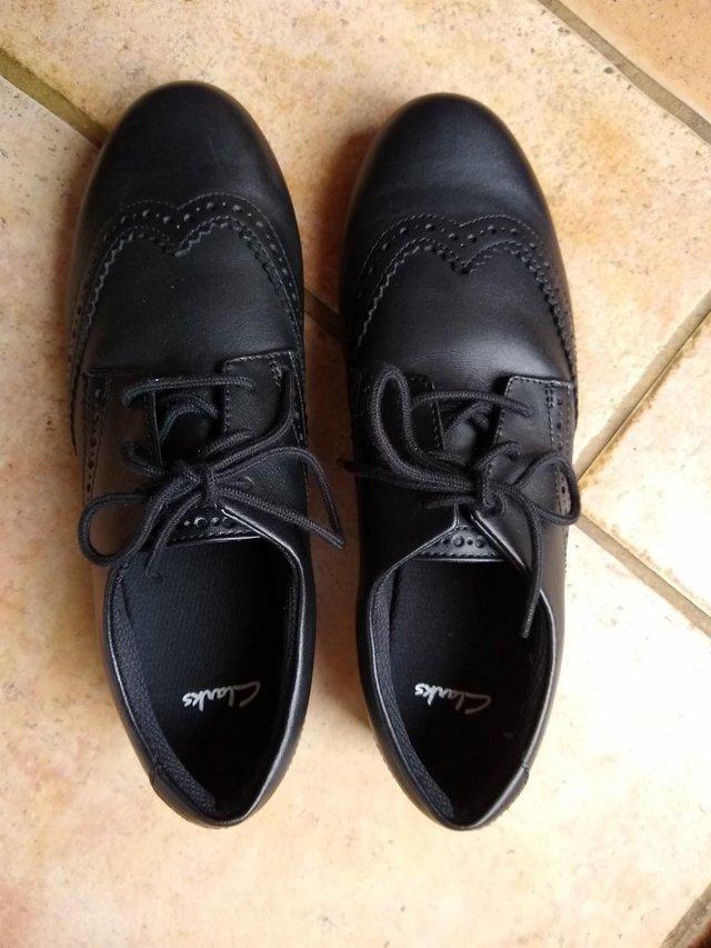 Preview of the first image of Size 6 black Clarks shoes, unworn.