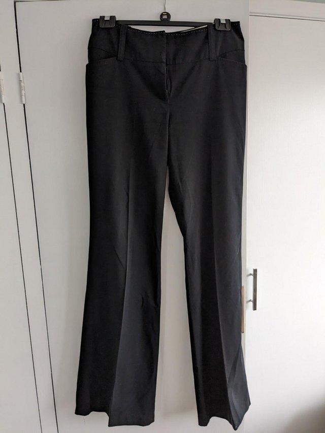 Preview of the first image of Next 12XL Black tailored boot cut trousers.