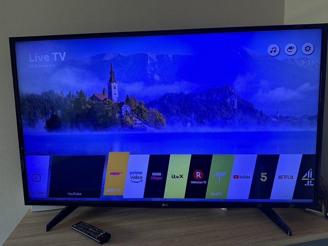 Preview of the first image of LG 55 inch TV with remote.