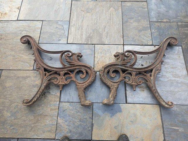 Preview of the first image of Stunning pair of griffin bench ends.