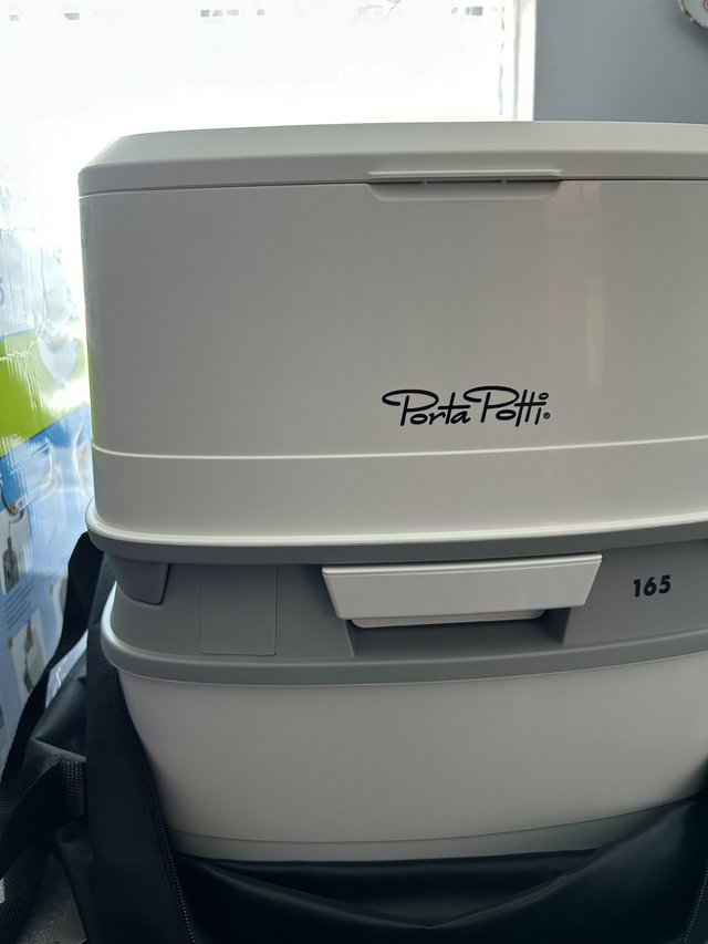Preview of the first image of Porta potti thetford 165 plus carry bag new.