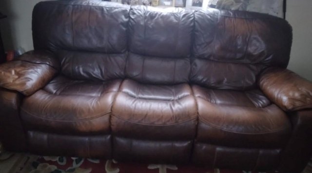Preview of the first image of Genuine Leather recliner sofa + as New Recliner Armchair.