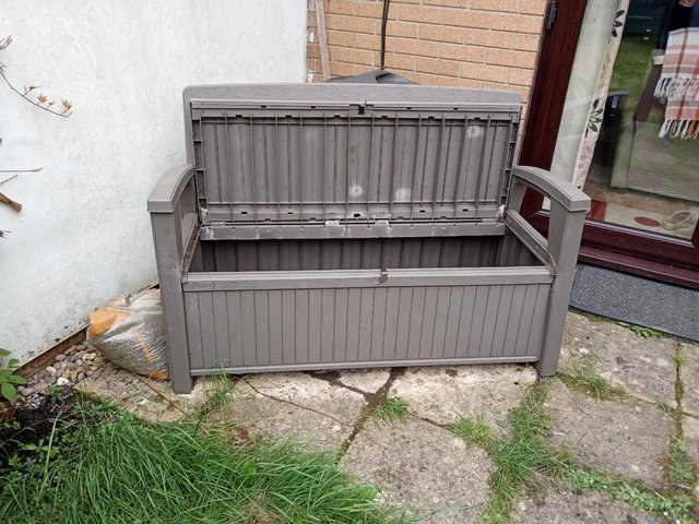 Preview of the first image of 7 year old B&Q brown garden storage 265 litre box with seat.