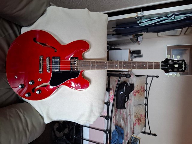 Preview of the first image of Epiphone 335 electric guitar 6 months old.