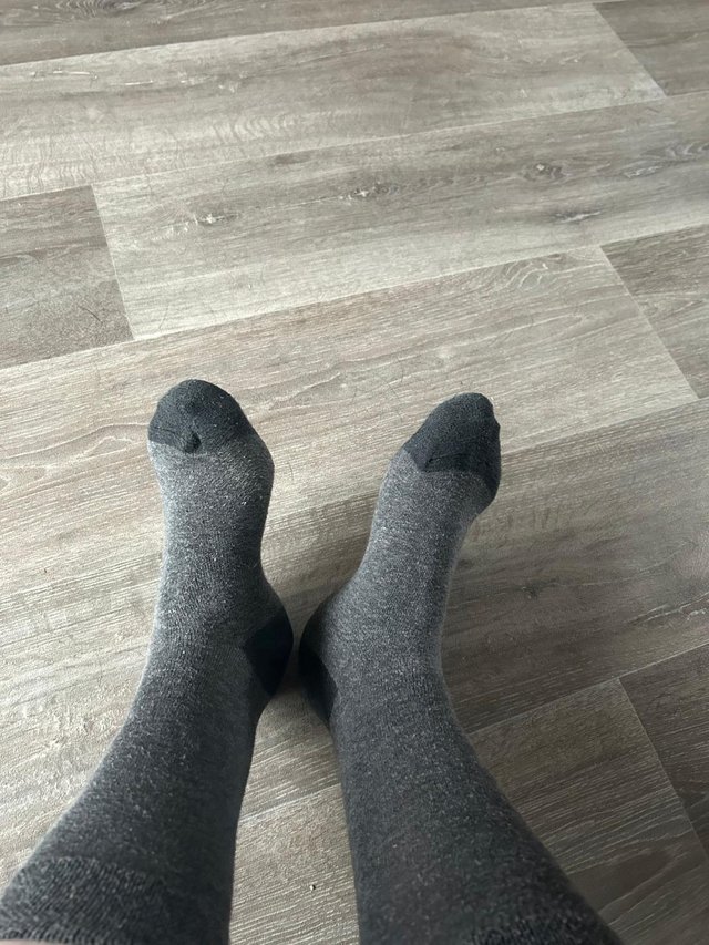 Preview of the first image of Ladies worn grey socks size 5.