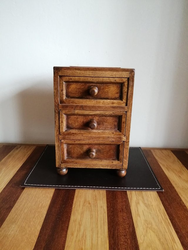 Preview of the first image of Small dark wooden tabletop solid chest of 3 drawers.